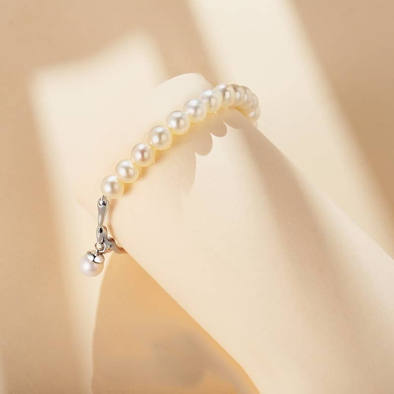 Freshwater Pearl and Silver Brach with a Pearl Charm Bracelet